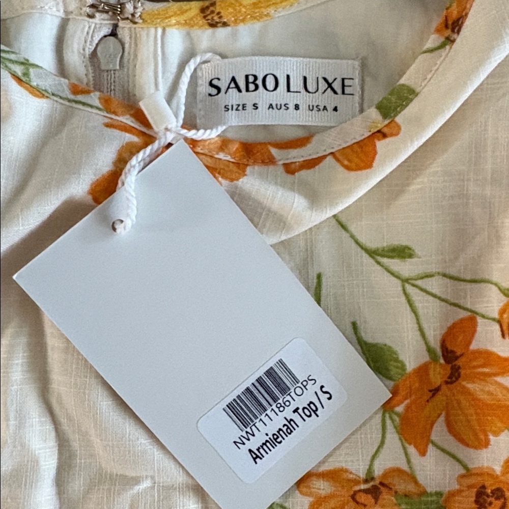 Floral Smocked Puff-Sleeve Crop Top in White with Orange & Yellow Blooms - Picture 2 of 6